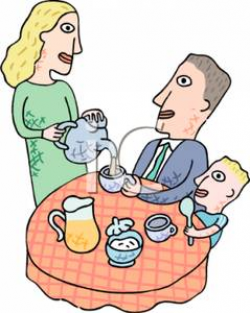 A Family Sitting At the Breakfast Table with the Mother Pouring ...