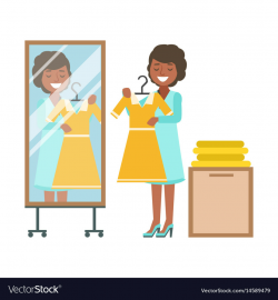 Woman trying on yellow dress in dressing room