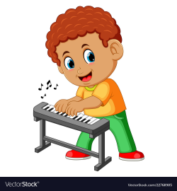 Happy little boy playing piano