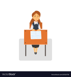 Diligent female student sitting at desk in